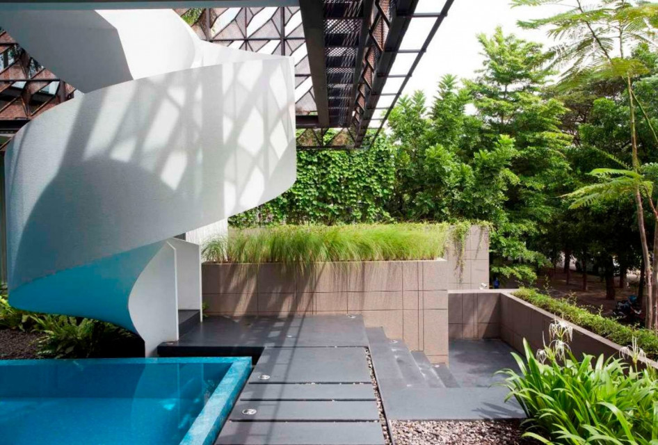 Rumah Keranjang Highlights Textured Materials on Facade and Swimming Pool as Focal Point